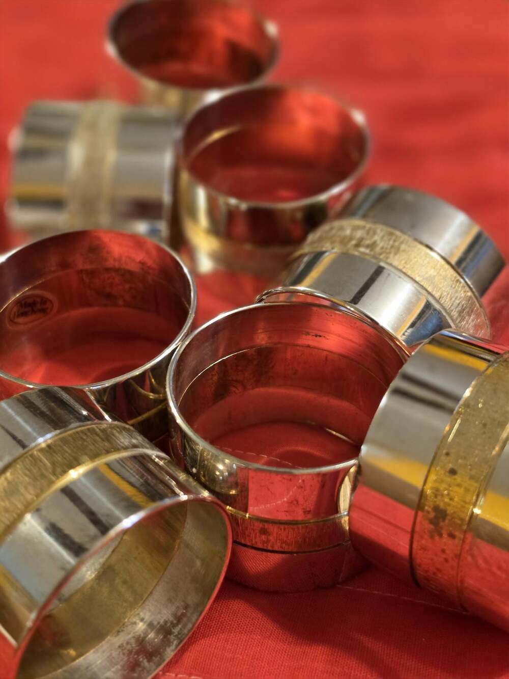 Set of eight round polished brass napkin rings Hong Kong